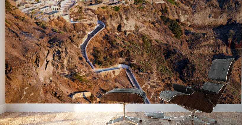Picturesque Santorini cliffside town with winding path and vibra Wall Murals