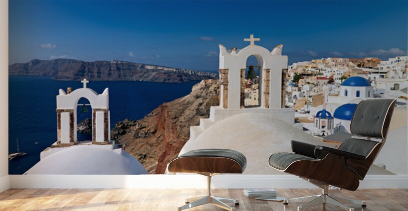 Santorinis iconic white churches blue domes and caldera view. Wall Murals