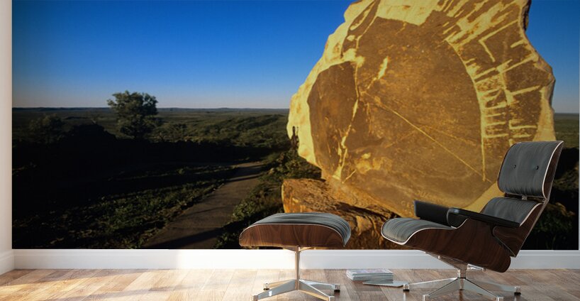 Carved stone monument in the Australian outback at sunset. Wall Murals
