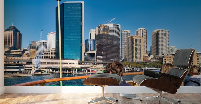 Ferry passengers enjoy city skyline view. Wall Murals