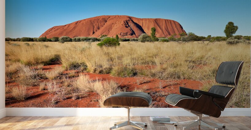 Uluru Australias iconic sandstone monolith under a clear blue Wall Murals