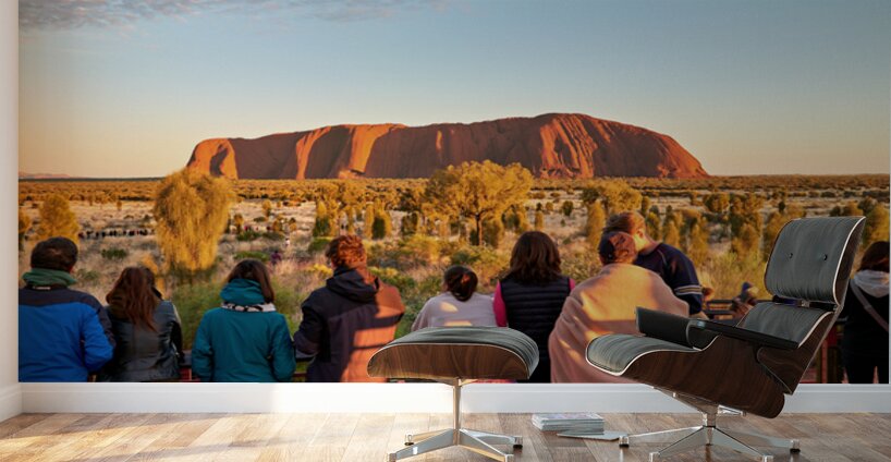 Tourists watch Uluru glow at sunrise. Wall Murals