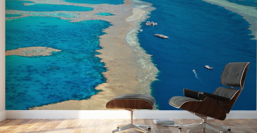 Aerial view of coral reefs and boats in turquoise ocean. Wall Murals