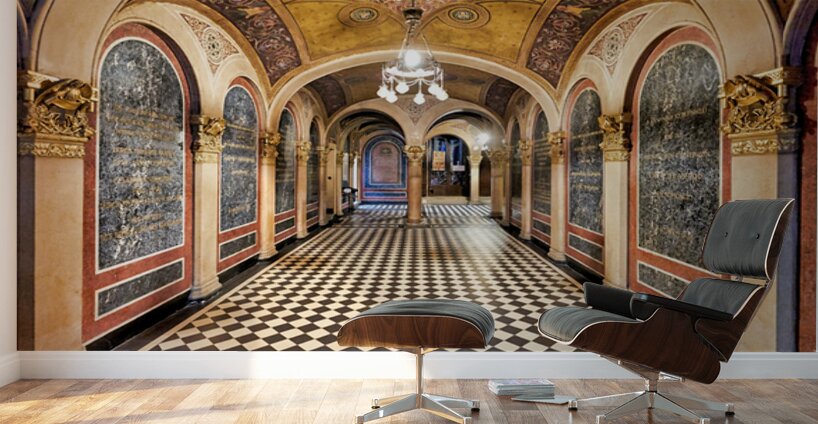 Historic church corridor with ornate arches and checkered floor. Wall Murals