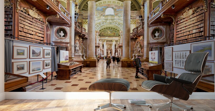 Grand ornate library interior with books columns and visitors Wall Murals
