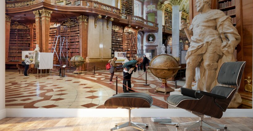 Ornate library interior with towering bookshelves statues glob Wall Murals