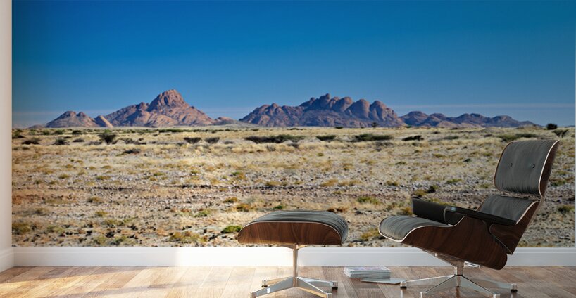 Granite peaks of Spizkoppe rise in Namib Desert landscape Wall Murals