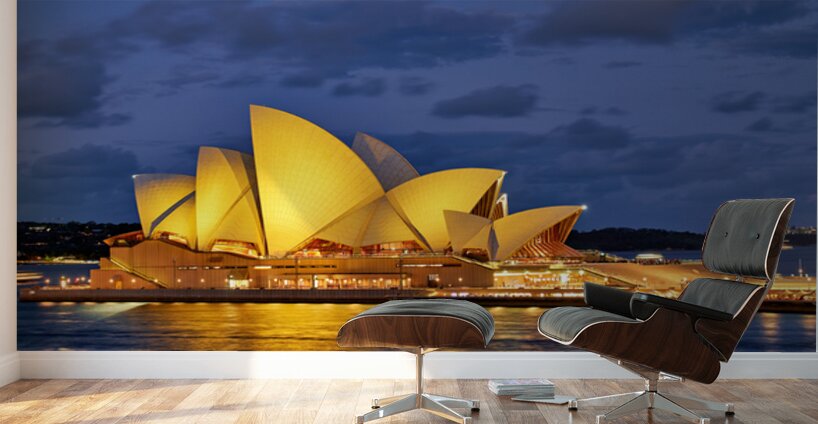 Sydney Opera House illuminated at dusk with harbor lights. Wall Murals