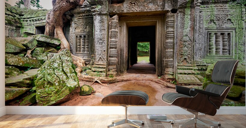 Ancient temple ruins overgrown by trees and moss. Wall Murals