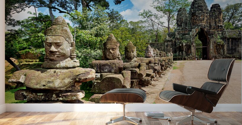 Ancient stone statues line path to Angkor Thom gate. Wall Murals
