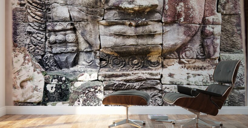 Ancient stone face carving framed in temple window. Wall Murals