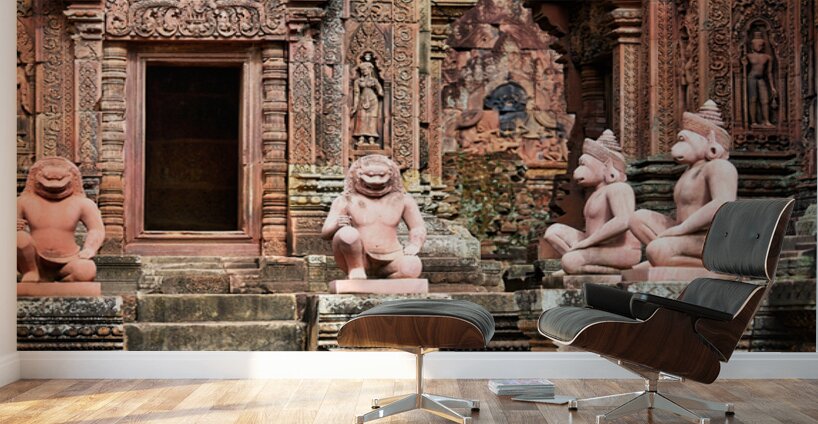 Ancient Cambodian temple with intricate red sandstone carvings a Wall Murals