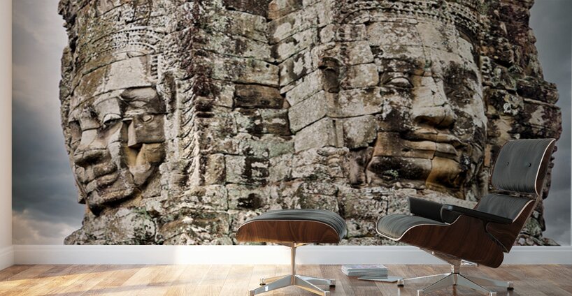 Ancient stone faces carved into Bayon Temple Cambodia. Wall Murals