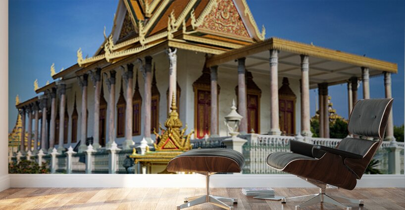 Majestic Cambodian temple under a blue sky with flying birds. Wall Murals