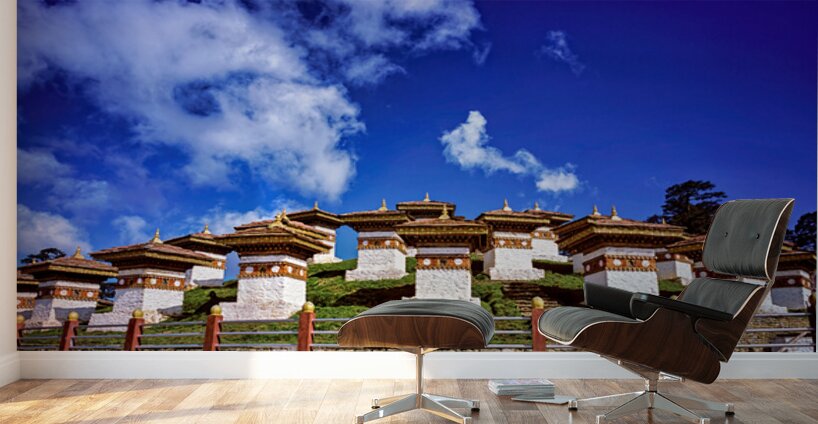 Traditional Bhutanese chortens on a green hill blue sky. Wall Murals