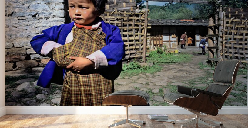 Young child in traditional Bhutanese dress in village. Wall Murals