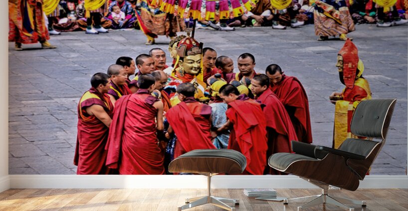 Monks in red robes gathered around a golden statue. Wall Murals