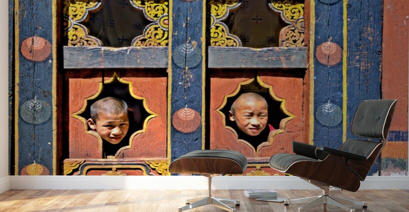 Young monks peeking from decorative colorful windows. Wall Murals