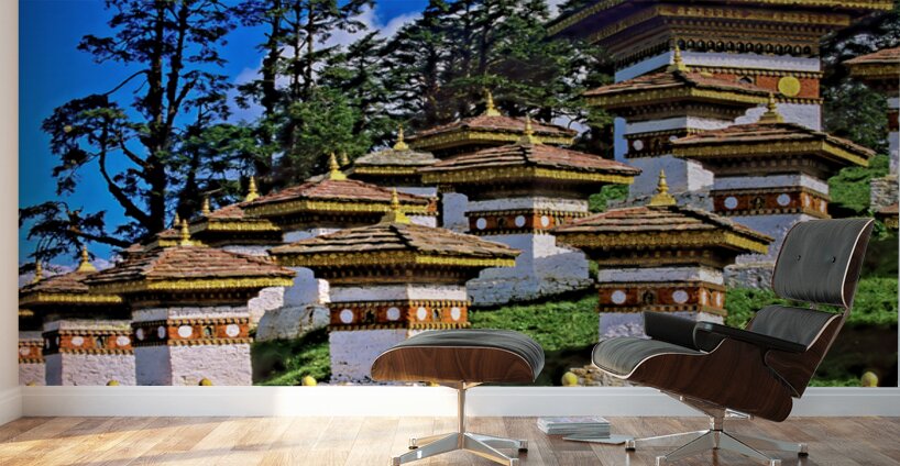 Druk Wangyal Chortens Bhutan with lush trees and blue sky. Wall Murals