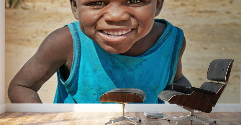 Joyful boy in Kavango Region of Namibia enjoys a moment outside Wall Murals