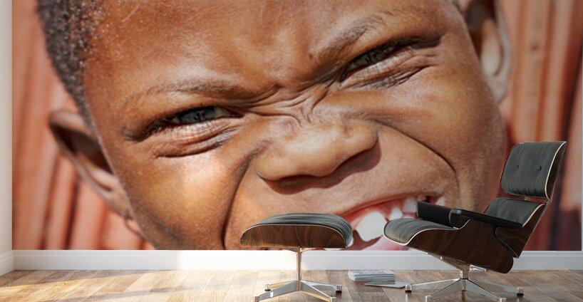 Joyful child smiles in Kavango Region of Namibia Wall Murals