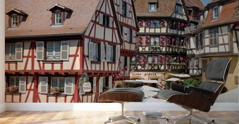 Visitors walk through Colmar on sunny day near timber framed hou Wall Murals