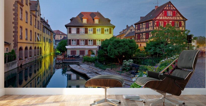 Timber framed houses and visitors in Colmar canals at dusk Wall Murals