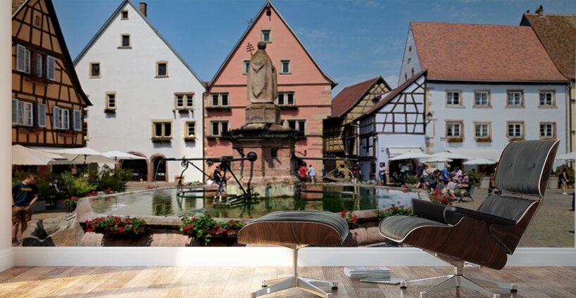 Visitors enjoy Saint Leon square in Eguisheim Alsace on a sunny Wall Murals