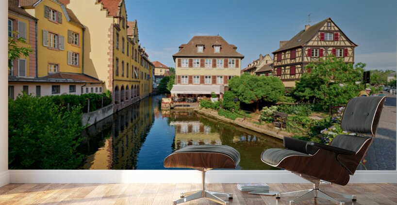 Visitors enjoy sunny day by canals in Colmar France Wall Murals
