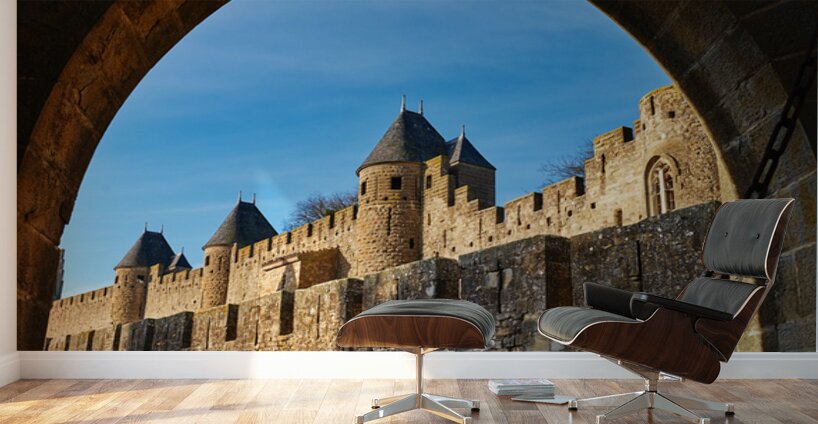 Exploring the historic walls of Carcassonne in France under blue Wall Murals