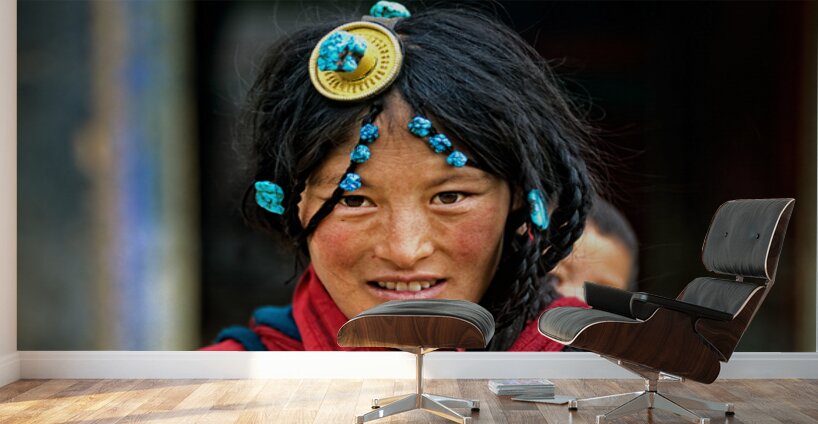 Traditional woman carries child in Tibet with ornate hair decora Wall Murals