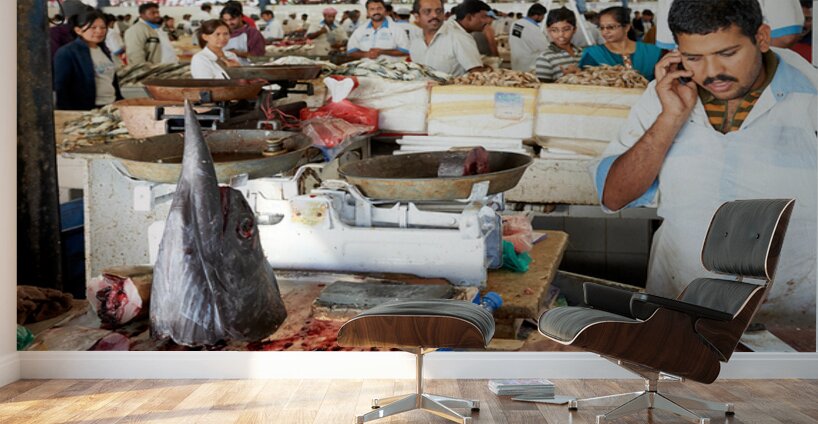 Man talks on phone at busy fish market in Dubai UAE Wall Murals