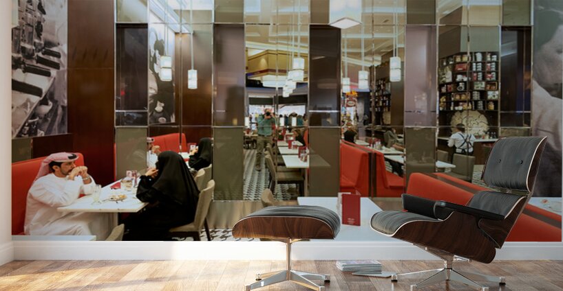 Dining in a modern restaurant with reflective walls in Dubai Wall Murals