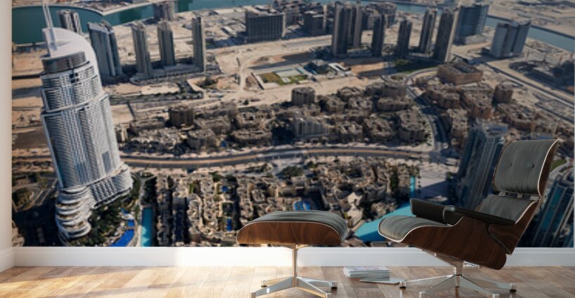 Dubai cityscape shows buildings water and desert from above Wall Murals