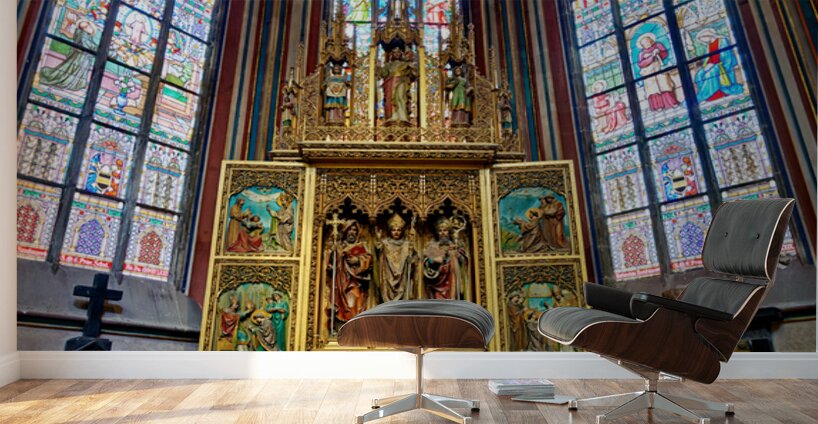 Ornate golden altarpiece and vibrant stained glass windows in a  Wall Murals