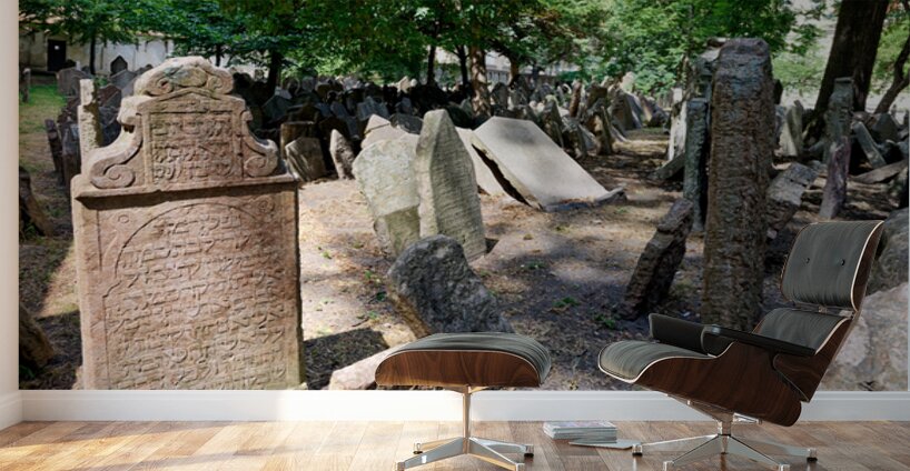 Ancient Jewish cemetery with weathered gravestones and trees. Wall Murals