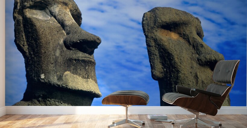 Two Moai statues against a blue sky. Wall Murals