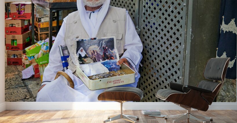 Beggar in the old city of Jerusalem seeks help from passersby Wall Murals