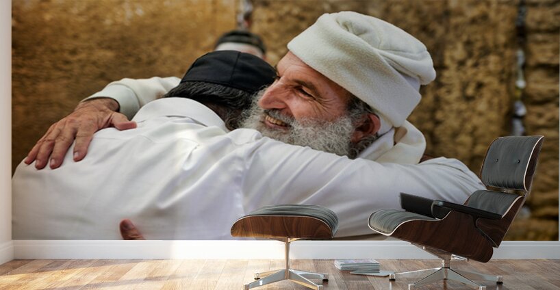 Men embrace each other at the Wailing Wall in Jerusalem Wall Murals