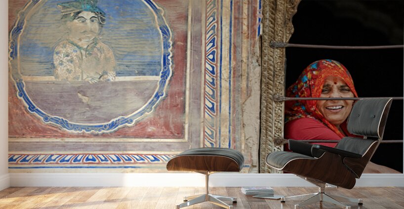 Woman smiles while looking out of a window in Mandawa Rajasthan Wall Murals