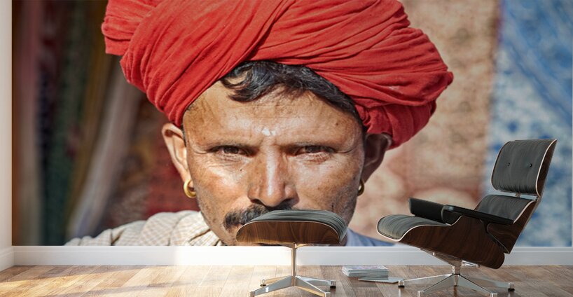 Man in red turban poses in Rajasthans Jaisalmer market street Wall Murals