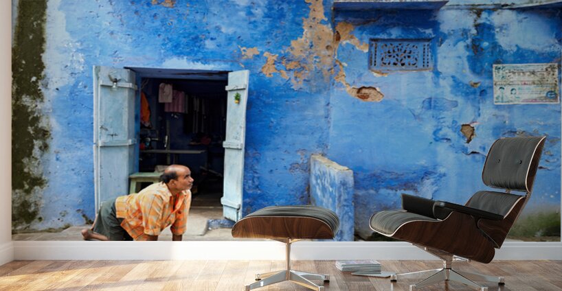 Man sweeps in front of home in Bundi Rajasthan during the day Wall Murals