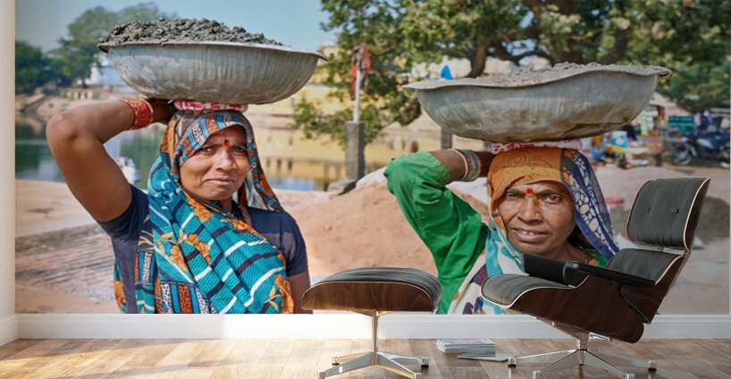 Women carry materials in Varanasi near the river bank Wall Murals
