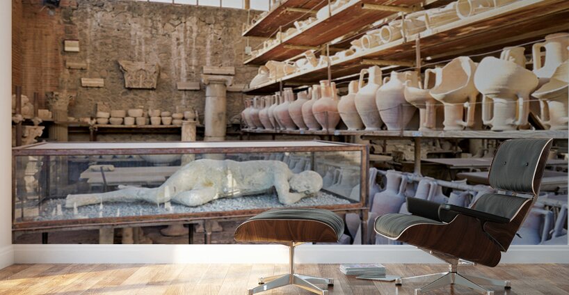 Pompeii site showing artifacts and a plaster cast of a victim Wall Murals