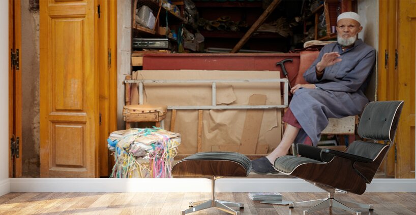 Old man in second hand shop at medina in Fez Morocco Wall Murals