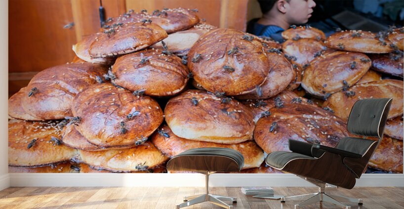 Loaf of bread covered in flies at market in Fez Morocco Wall Murals