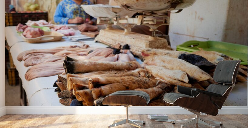 Butcher working in Meknes souk with various cuts of meat Wall Murals