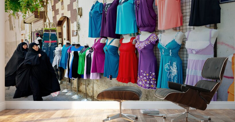 Women walk past colorful clothing displays in Damascus Syria Wall Murals