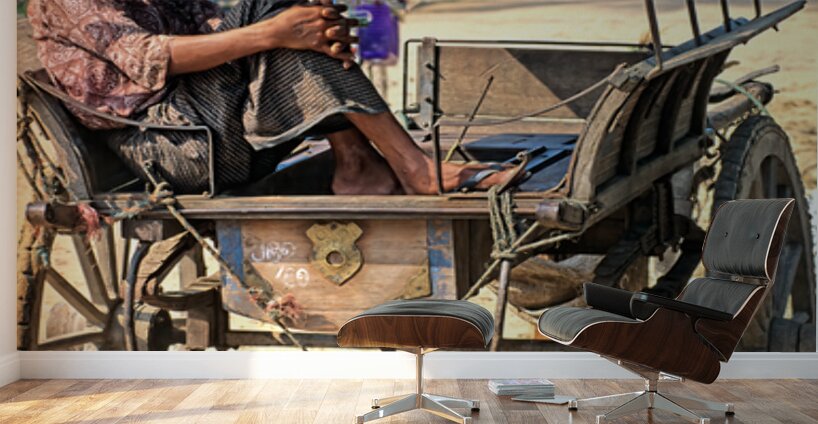 Man rests on cart in Myanmar during warm daytime Wall Murals