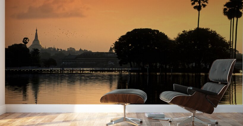 Sunset over the water in Yangon with palm trees and buildings Wall Murals